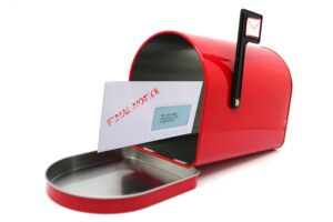 A ‘final notice’ letter in a red mailbox